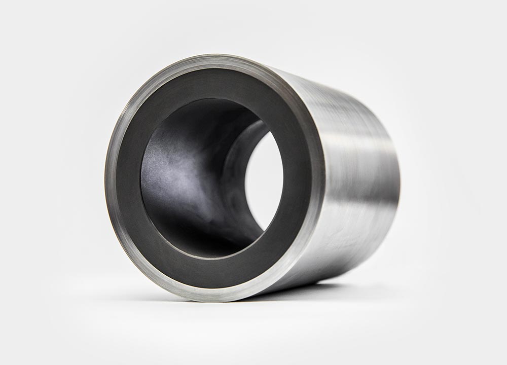 Metal backed carbon graphite bushing